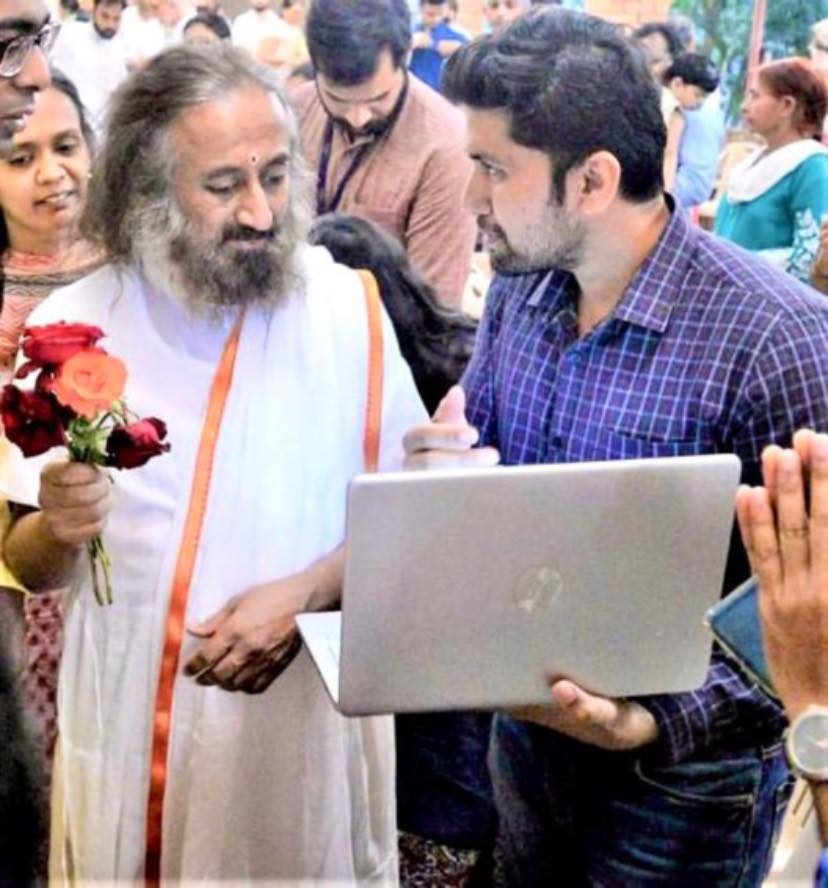 Yugendra Shreepati Bhonsle presenting a digital project to Gurudev Sri Sri Ravi Shankar
